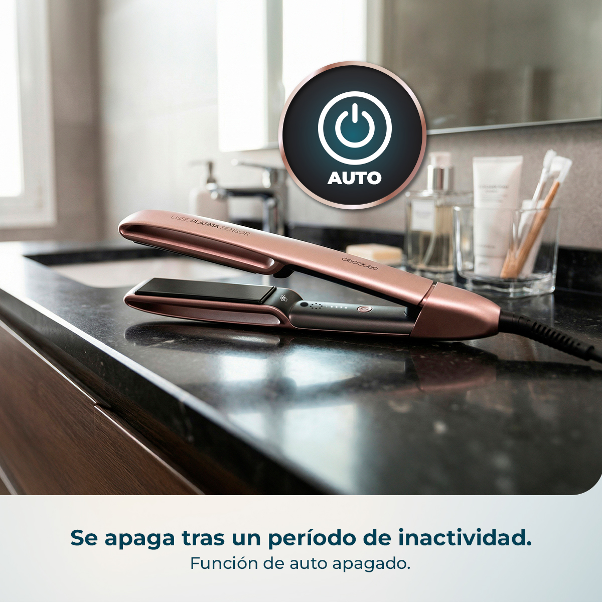 Plancha de pelo oro rosa con icono de apagado automático en tocador.