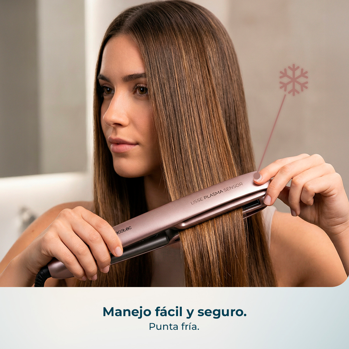 Mujer alisa cabello castaño con plancha oro rosa, indicada con icono de copo de nieve.