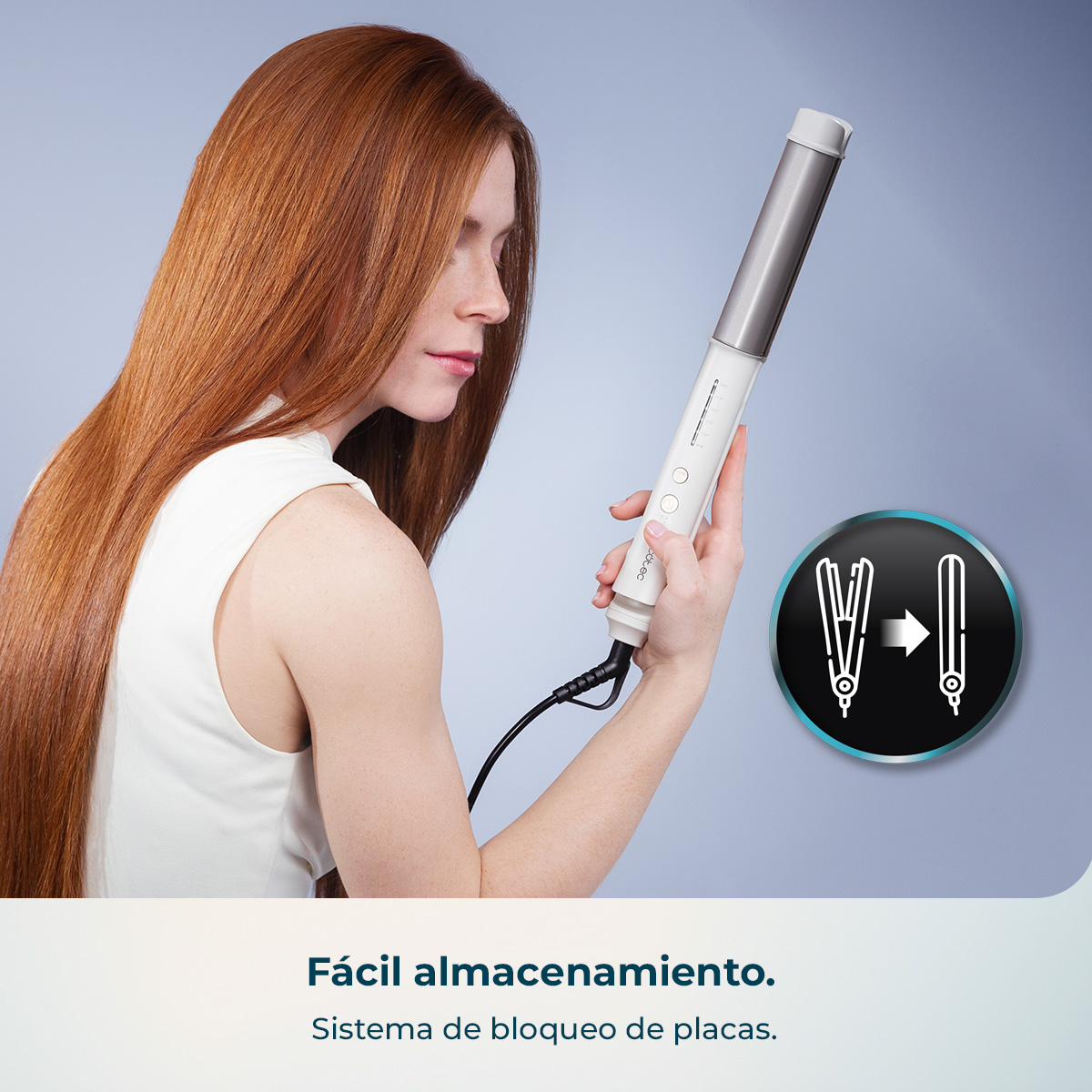 Mujer de pelo rojo largo sostiene una plancha blanca con accesorio plateado.