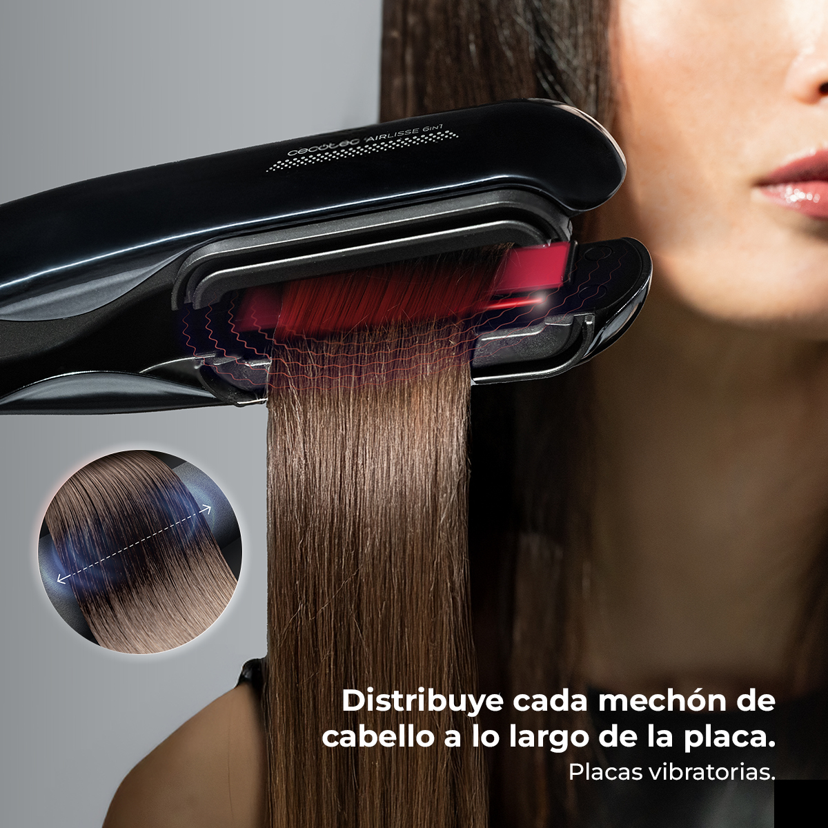 Plancha negra con líneas rojas brillantes alisa cabello castaño. Primer plano muestra placas vibratorias.