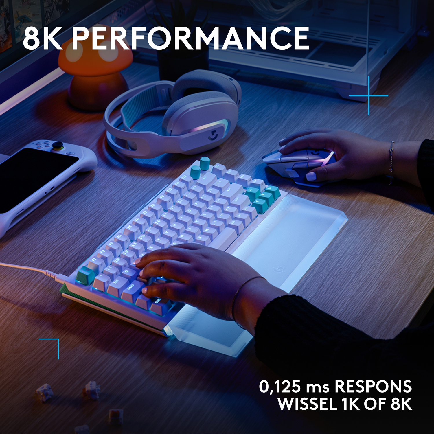Hands on keyboard and mouse, headphones, handheld device, and mushroom lamp.