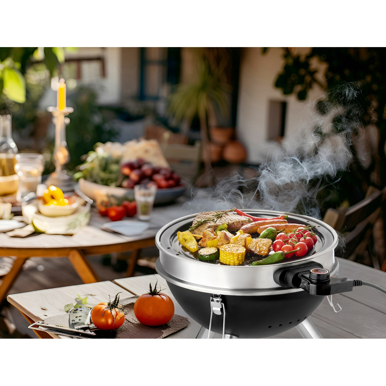 An electric grill with meat, sausages, vegetables, and corn on a wooden table.