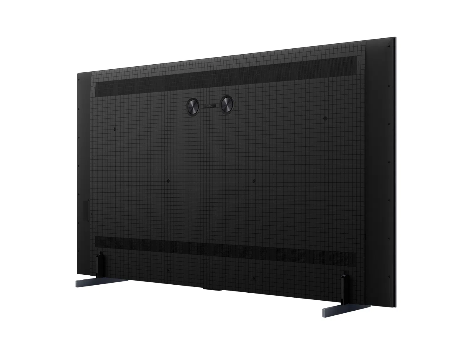 La parte trasera de un televisor negro con un patrón a cuadros y dos botones circulares.