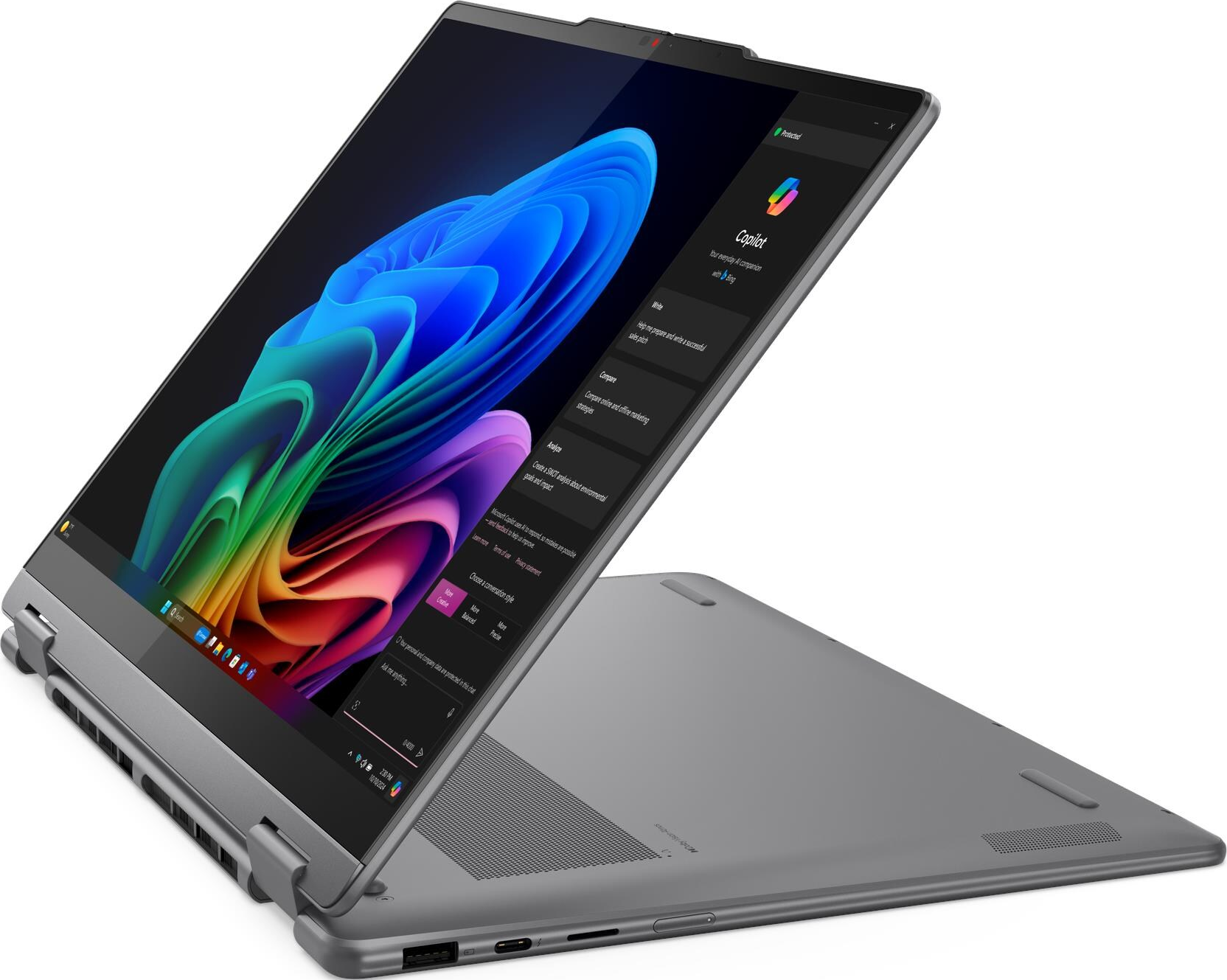 Grauer Laptop mit geöffnetem Bildschirm, der Copilot-KI-Funktionen anzeigt.