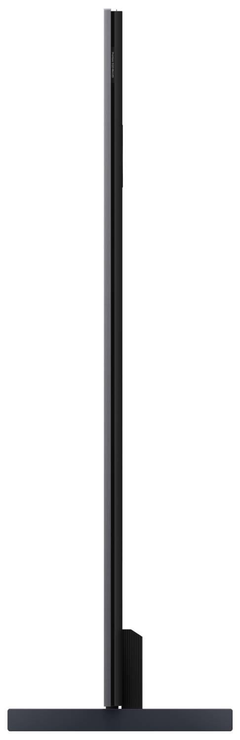 Un televisor negro y delgado con una base ancha y plana. Vista lateral.