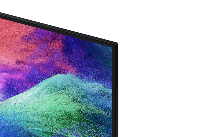 Un borde de pantalla negro con un patrón polvoriento y colorido de púrpura, azul y verde.
