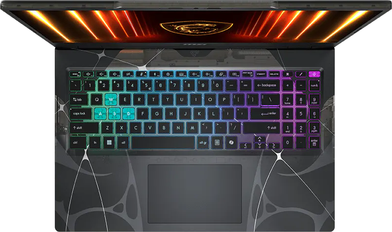 Egy nyitott laptop háttérvilágítású billentyűzettel és piros/narancssárga háttérrel.