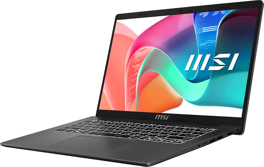 Egy sötétszürke MSI laptop nyitva van, színes absztrakt háttérképet és világító billentyűzetet mutat.