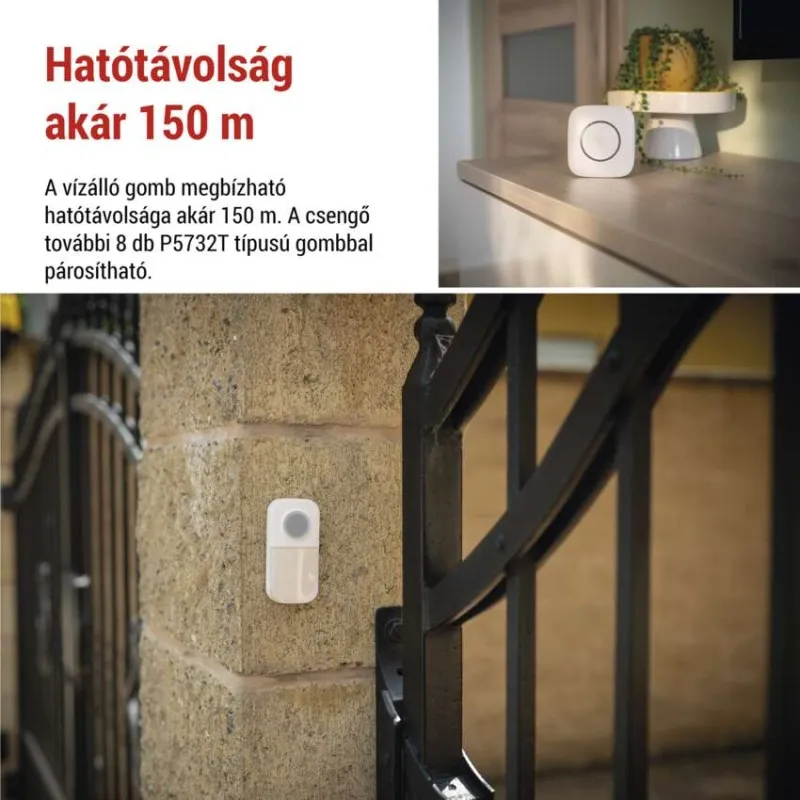 Egy fehér vezeték nélküli ajtógomb van felszerelve egy kőfalra egy fekete kapu mellett.