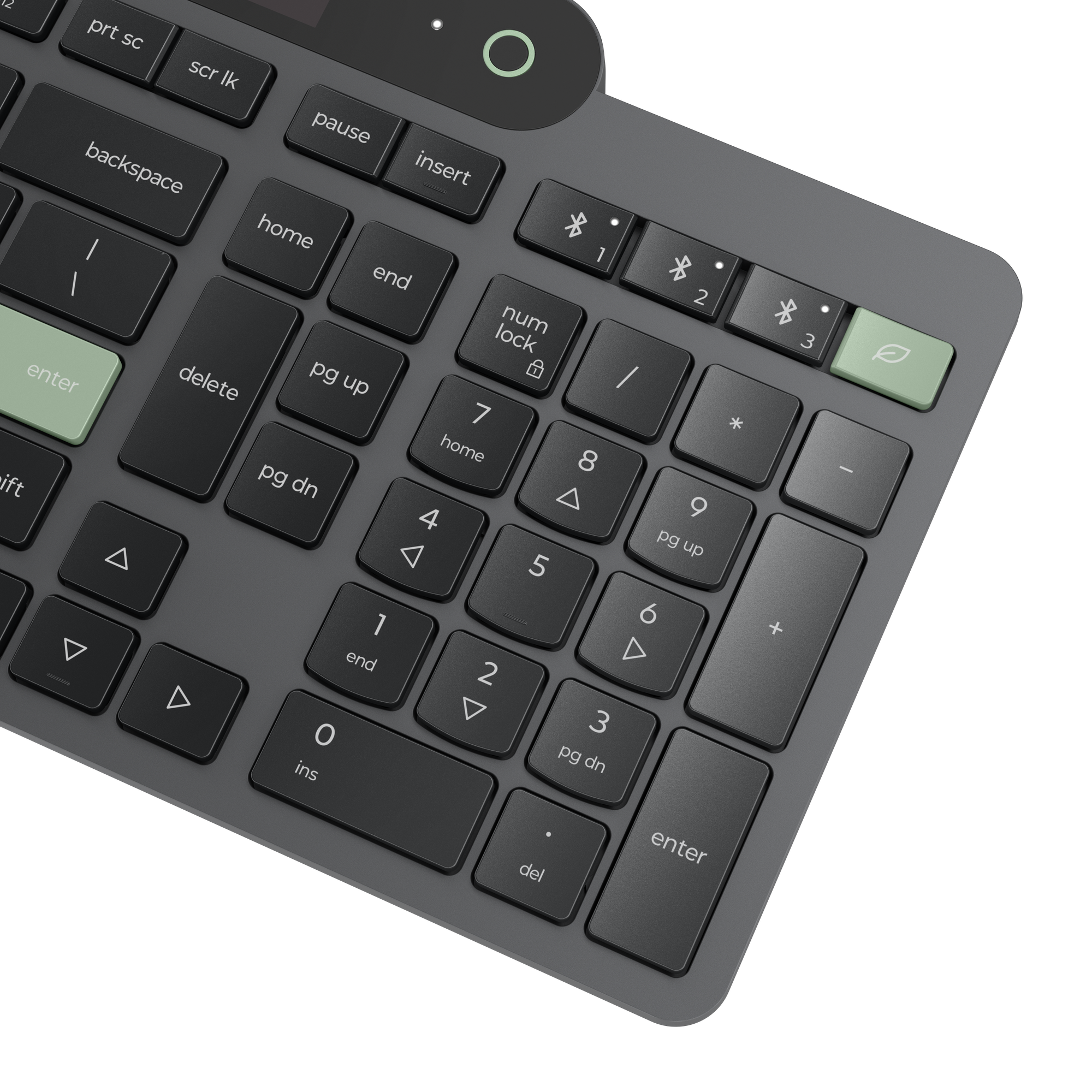 Primer plano de un teclado oscuro con tecla Enter verde y símbolo de hoja.
