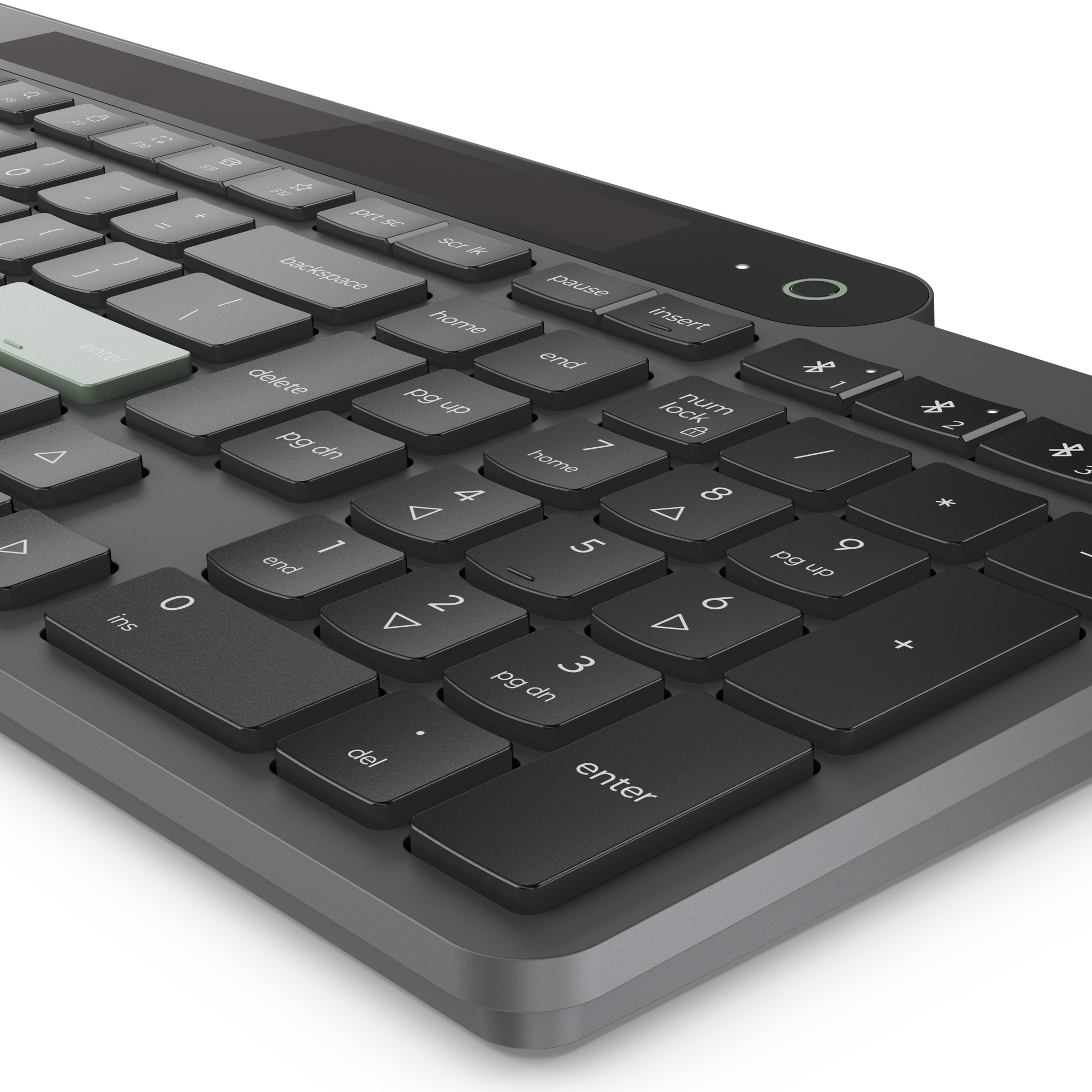 Teclado gris con tecla Enter verde sobre fondo negro.