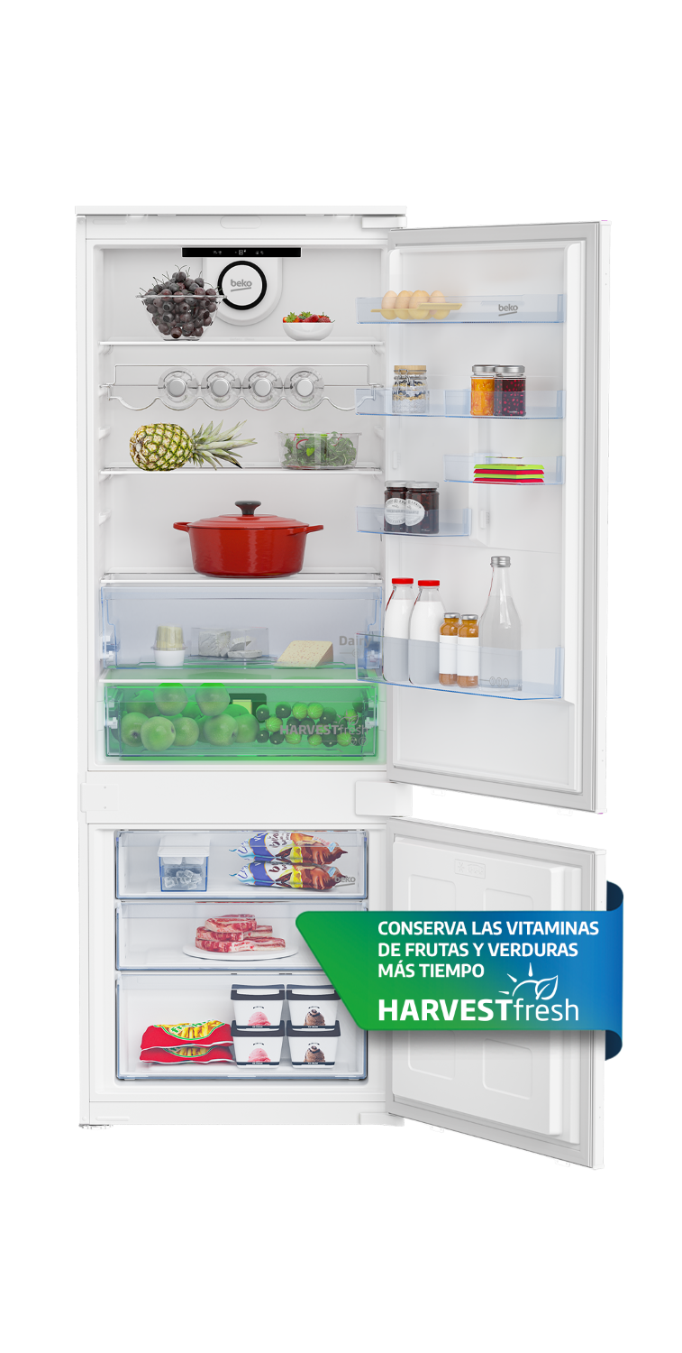 Un refrigerador abierto lleno de alimentos y cajones.