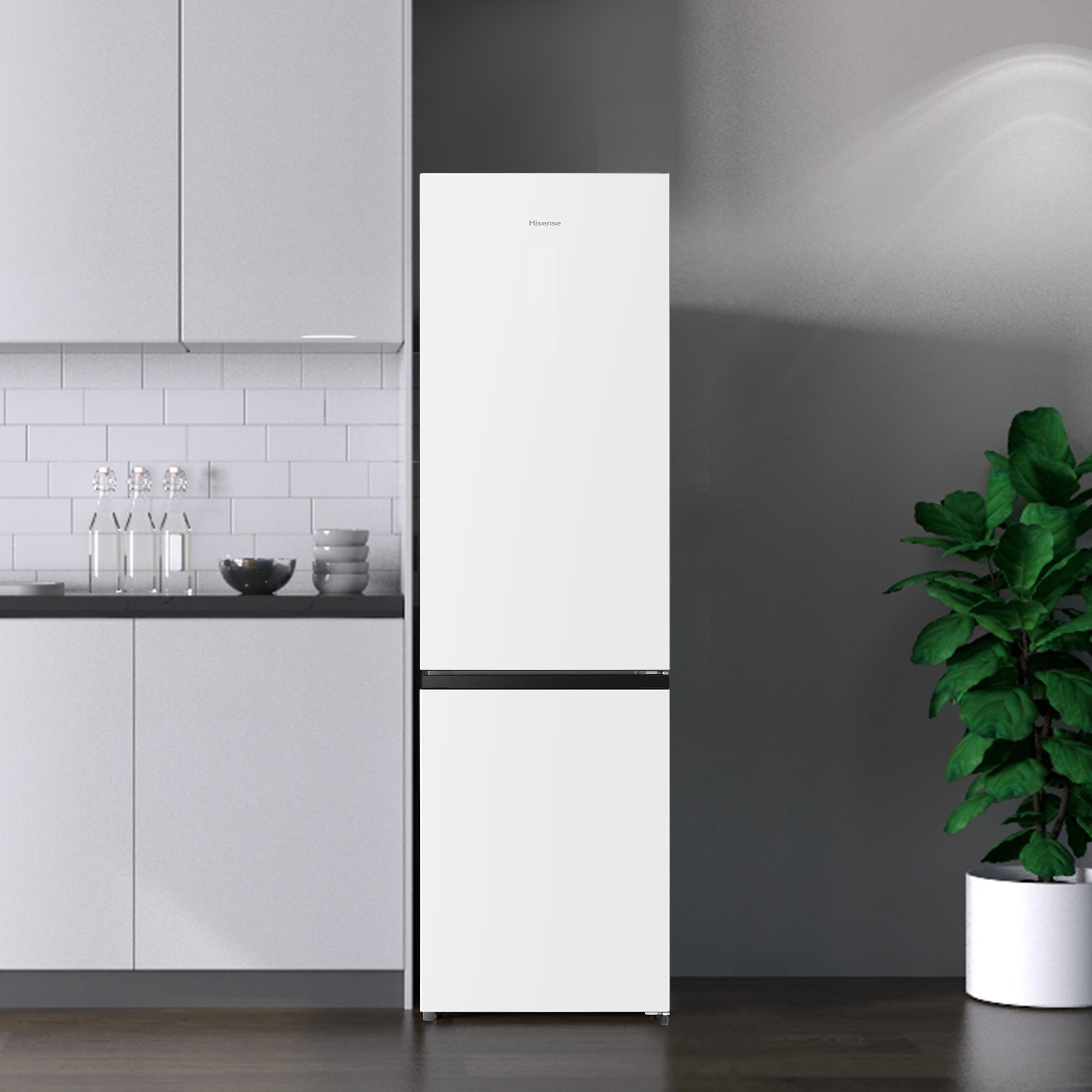 Un refrigerador blanco de dos puertas en una cocina moderna.