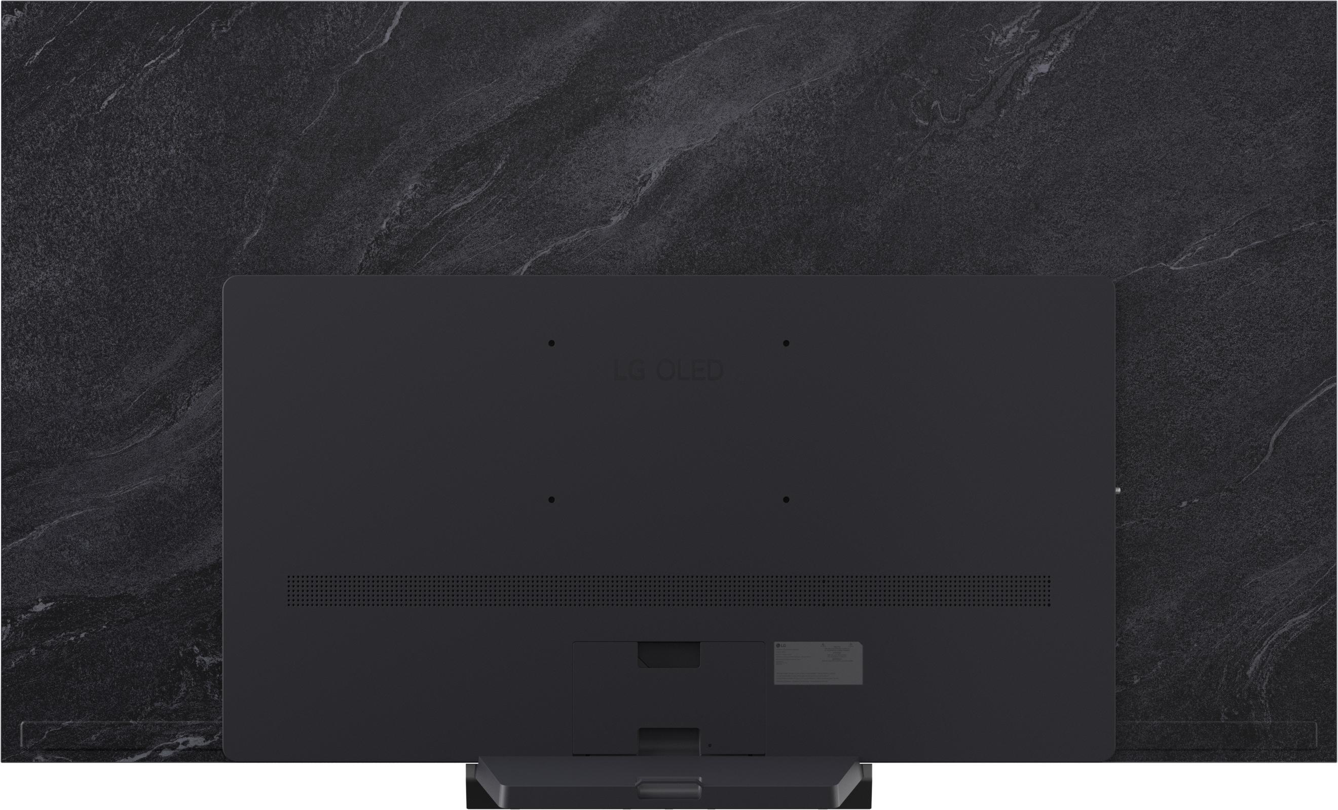 Rückseite eines schwarzen LG OLED Fernsehers mit Marmor-Effekt Hintergrund.