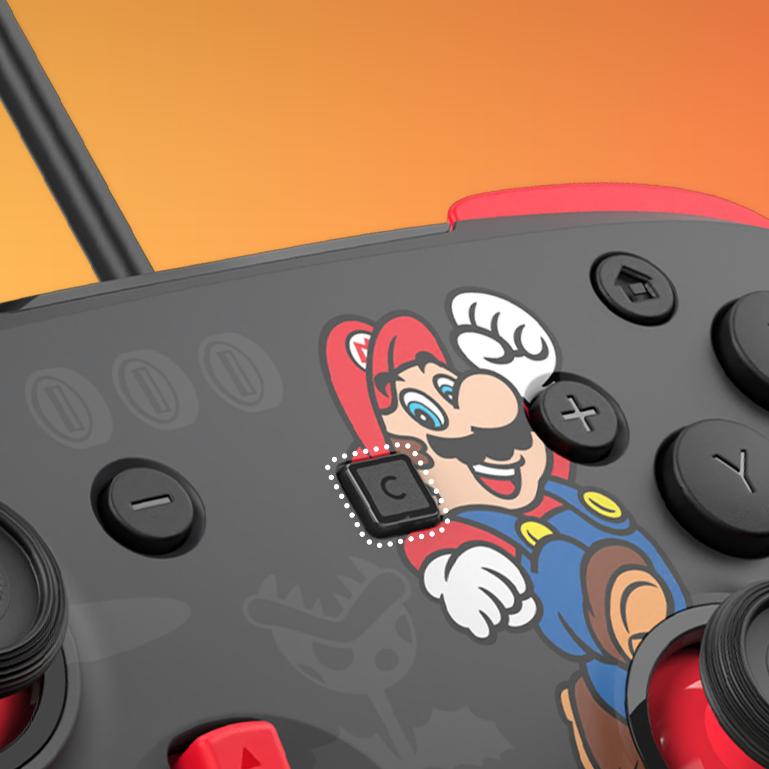 Zwarte controller met Mario-afbeelding, rode accenten en knoppen.