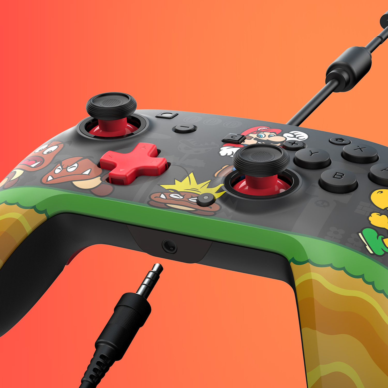 Een Mario-controller met Goomba's en paddenstoelen, met kabel en koptelefoonaansluiting.