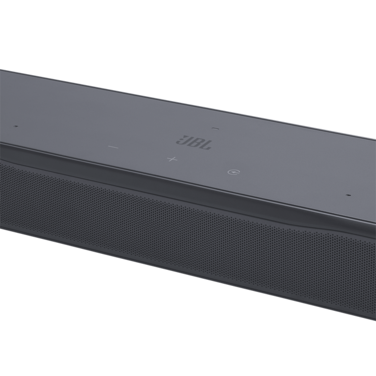 Barra de sonido JBL gris oscuro con frente perforado y botones arriba.