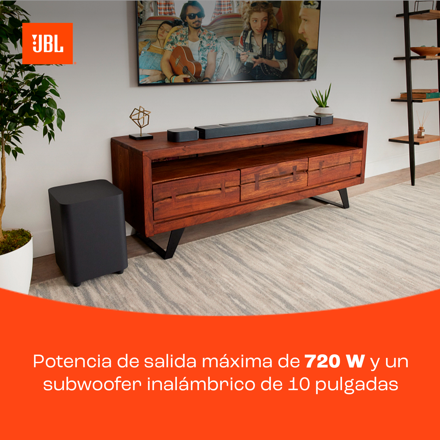 Sala de estar con barra de sonido JBL, subwoofer, TV y consola.