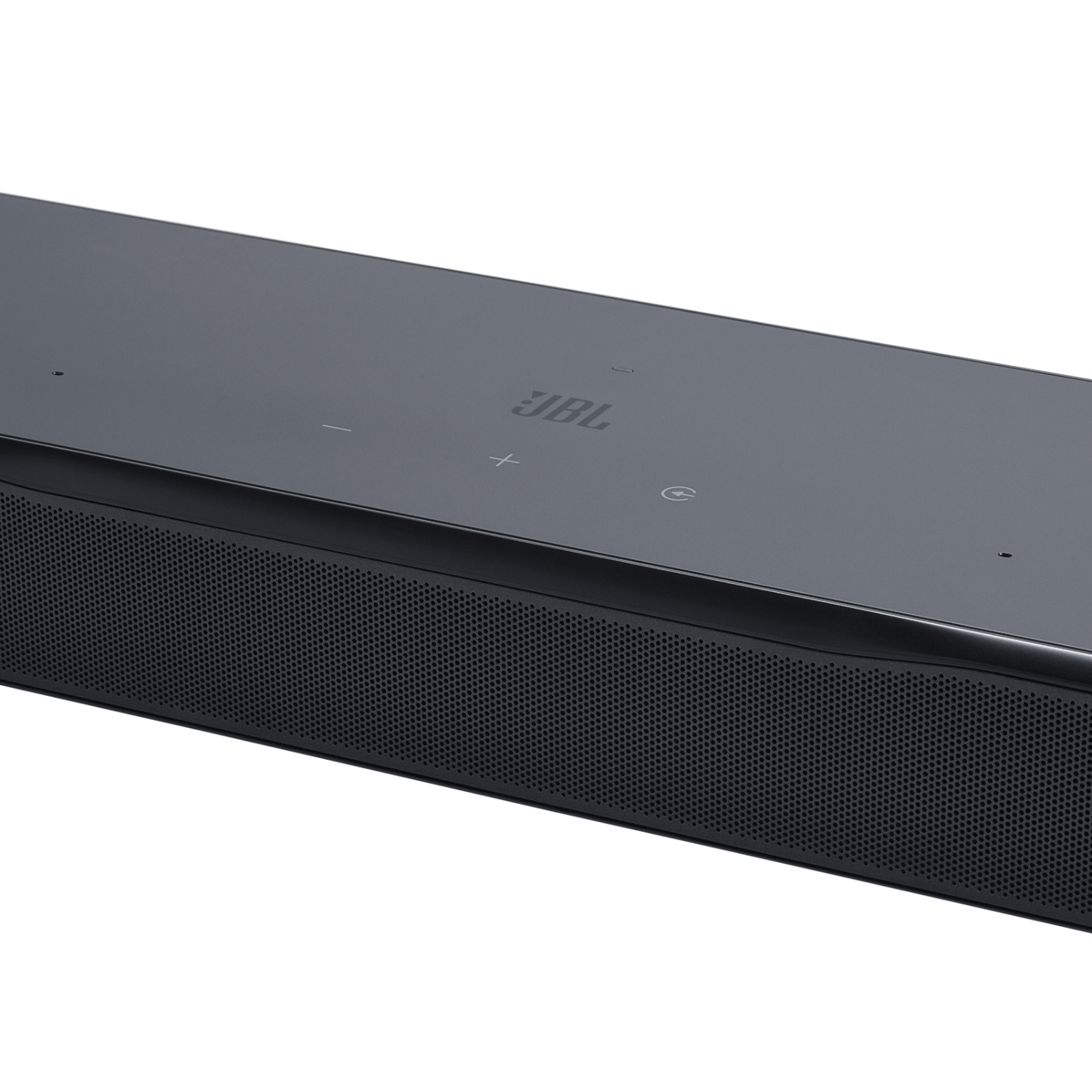 Se muestra una barra de sonido JBL negra con controles táctiles y rejilla perforada.
