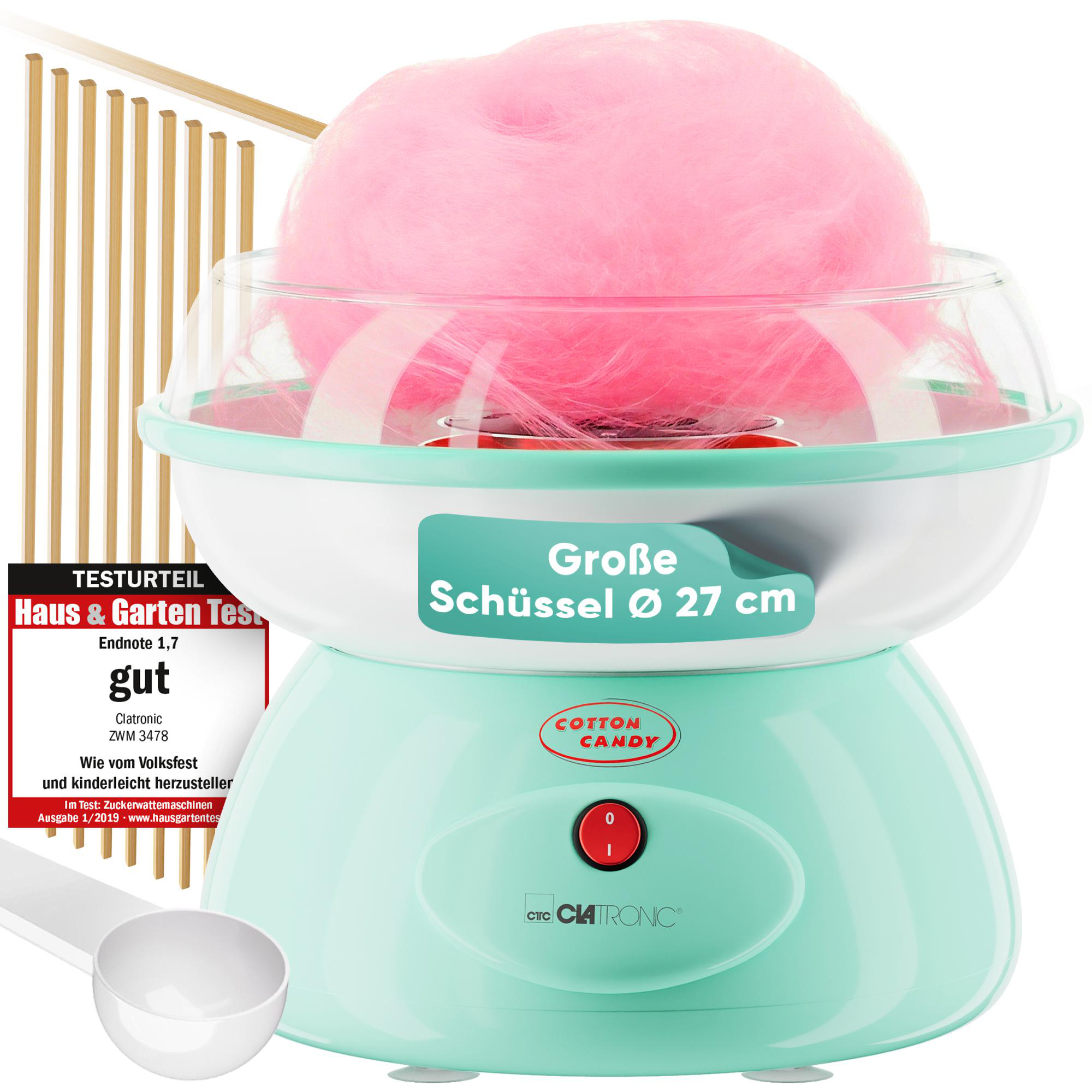 Ein mintgrüner Zuckerwattemaker mit rosa Zuckerwatte und Messlöffel.