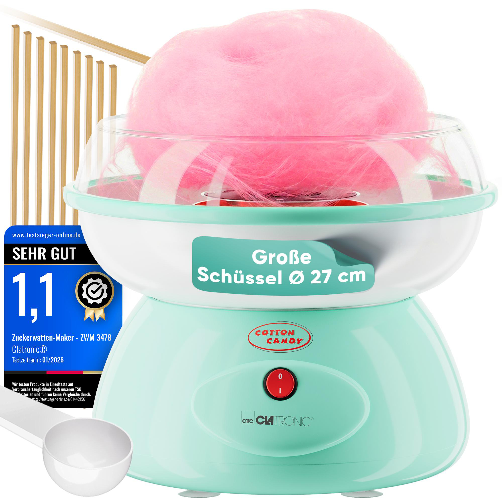 Ein mintgrüner Zuckerwattemaker mit pinker Zuckerwatte und einer großen Schüssel.