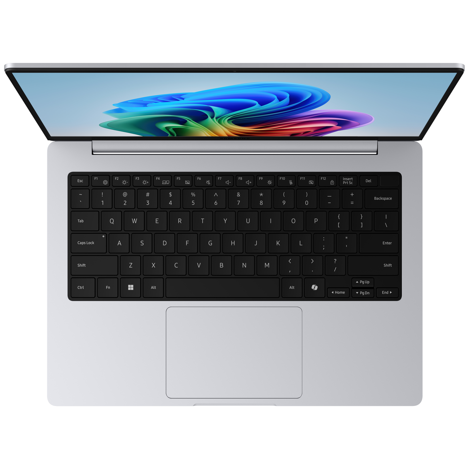 A silver laptop is open, displaying a colorful abstract wallpaper on its screen.