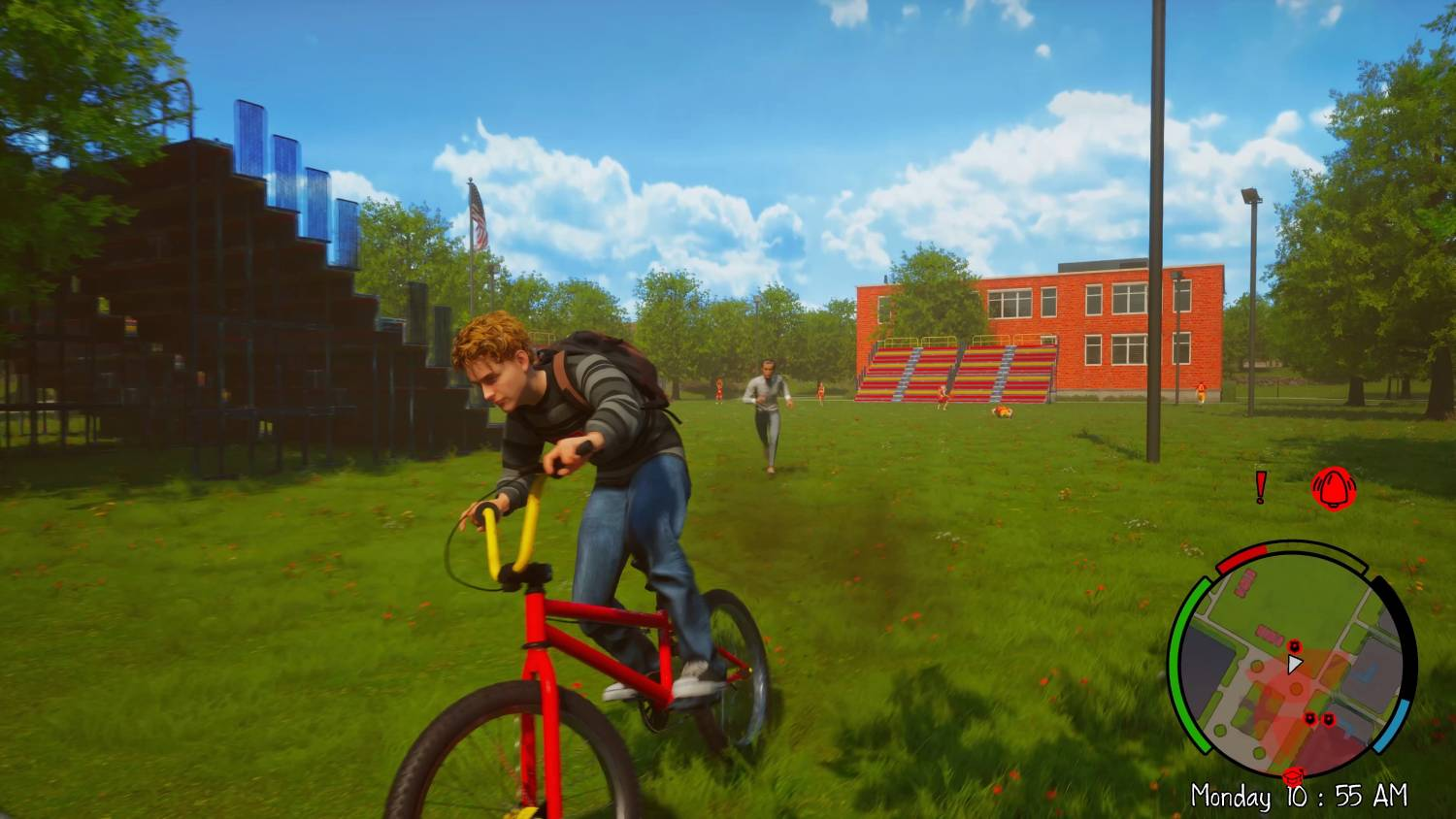 Un chico monta en BMX sobre césped frente a una escuela. Gradas y árboles al fondo.