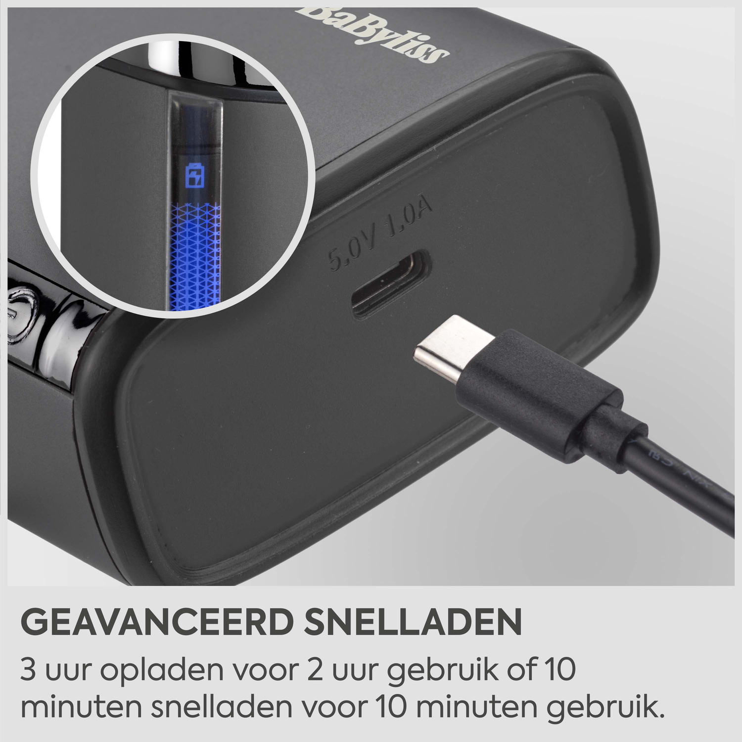 Black charger with USB-C port and charge indicator. A cable is connected.
