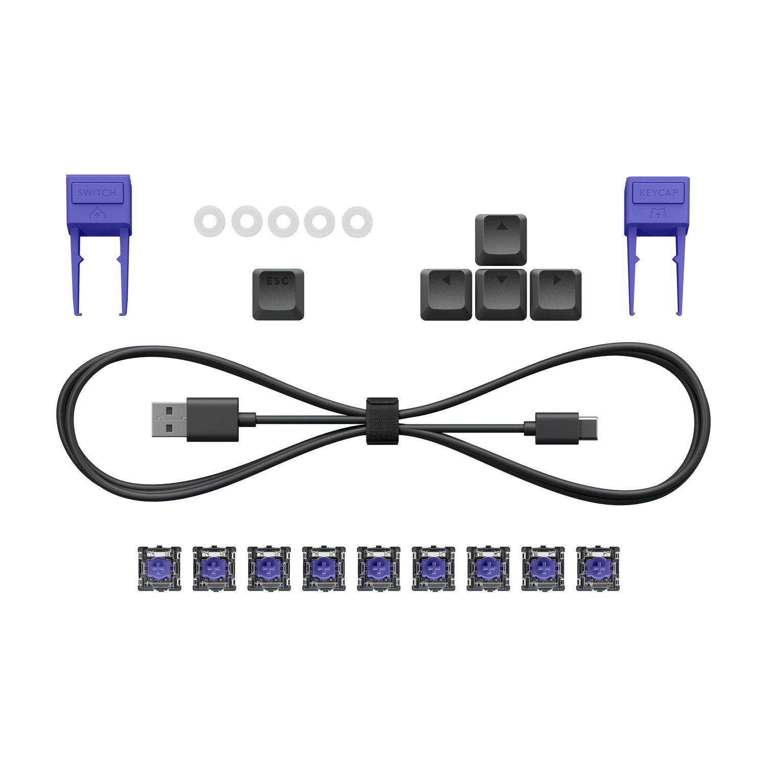 Un kit tastiera con switch, keycaps, cavo e attrezzi.