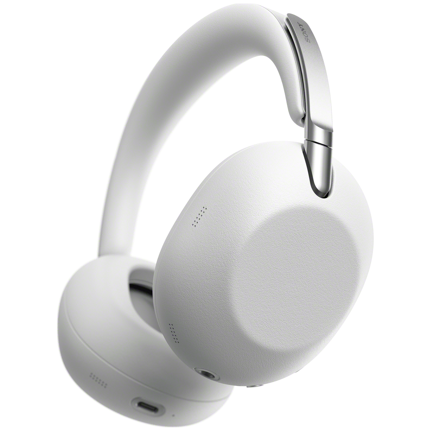 White Sony over-ear headphones with silver accents, isolated on a white background.