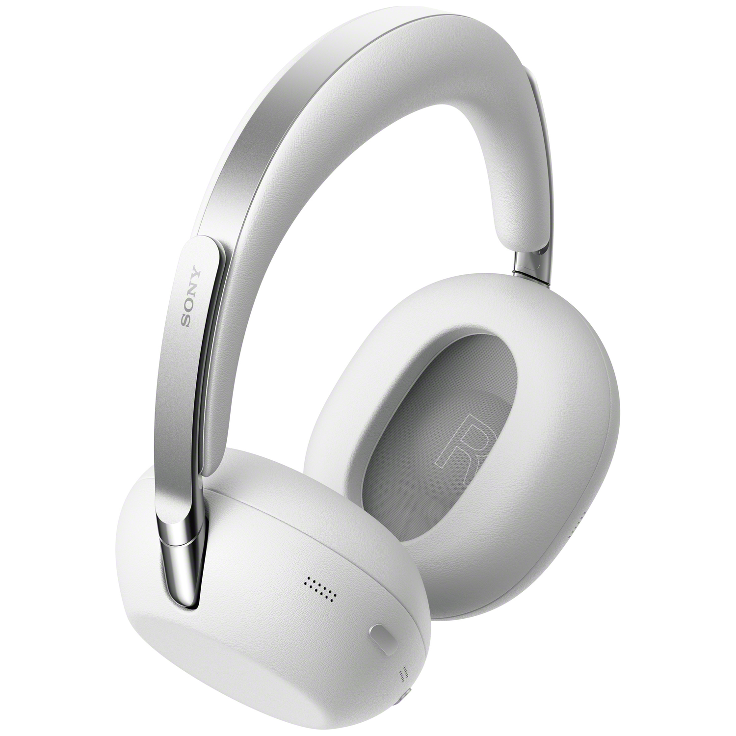 A white Sony over-ear headphone with silver accents sits on a white background.