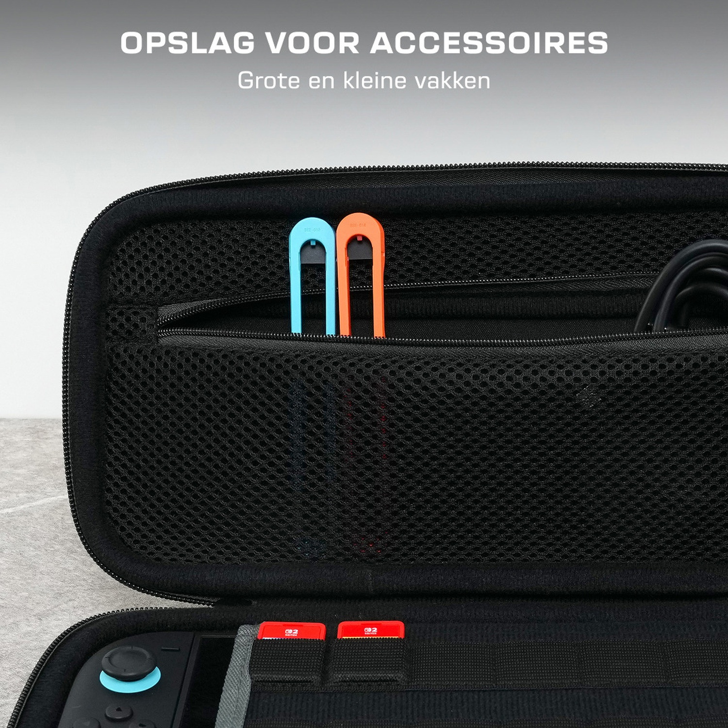 Black case with two blue and orange grips and two red game cards.