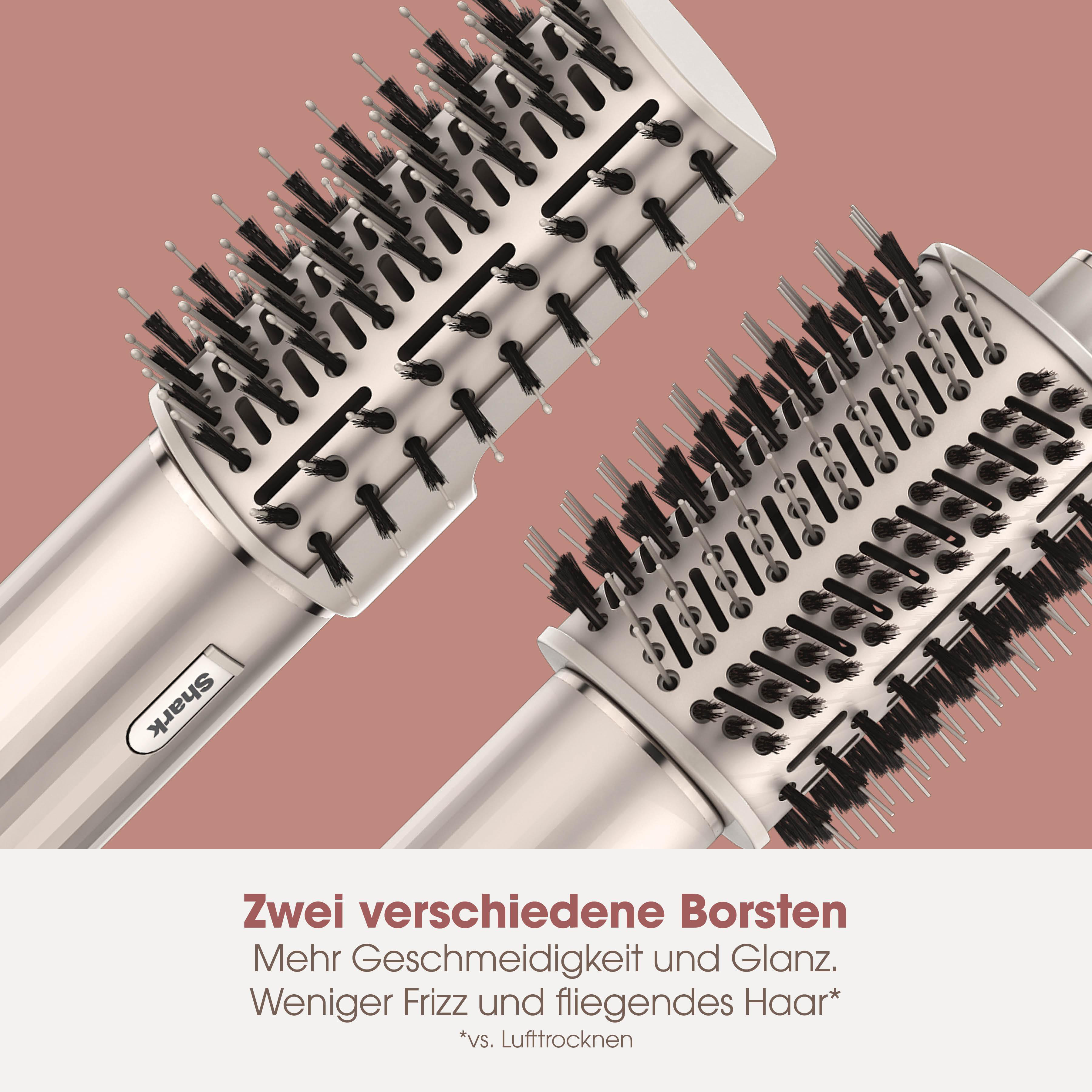 Zwei runde Haarbürsten mit schwarzen Borsten und silbernen Griffen auf rosa Hintergrund.