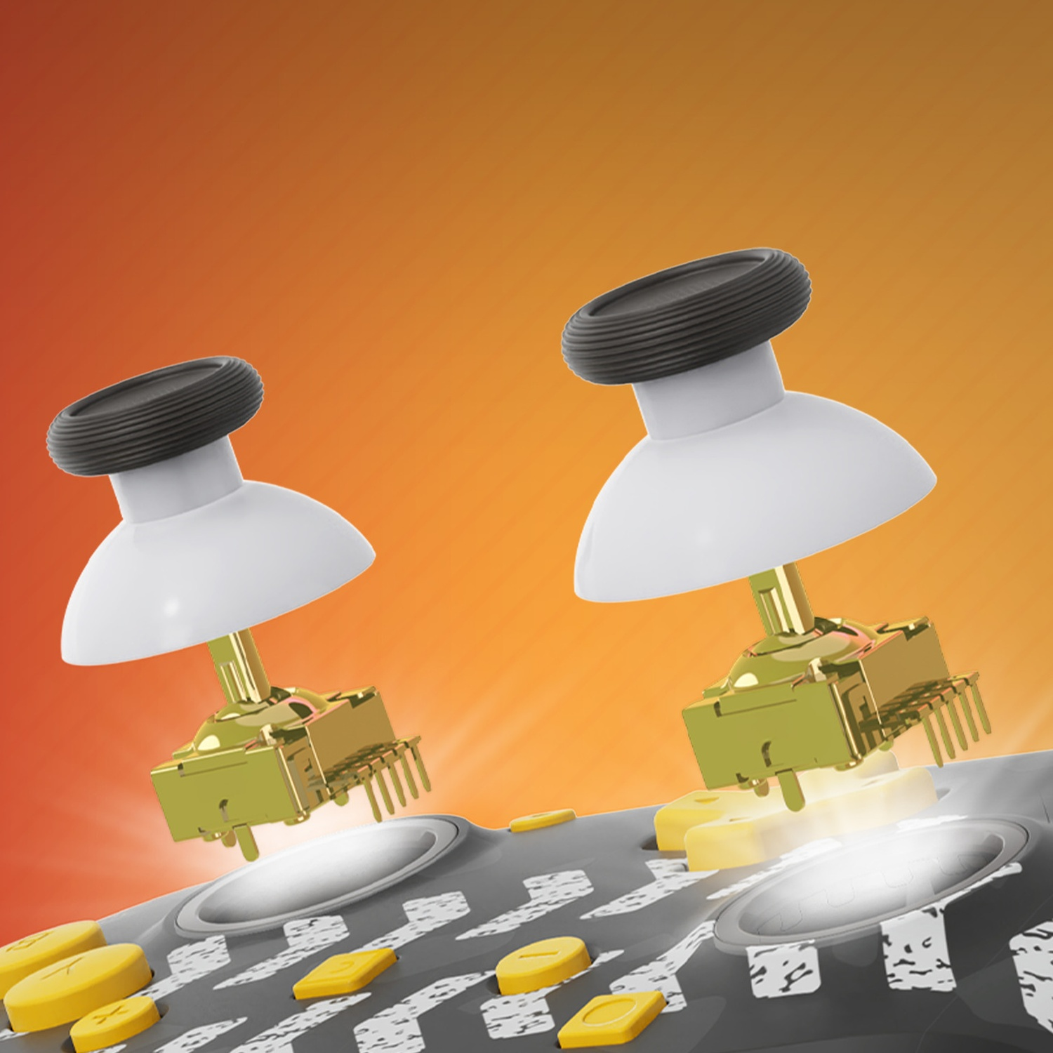 Deux modules de joystick dorés avec des capuchons blancs sur une surface grise avec des boutons jaunes.