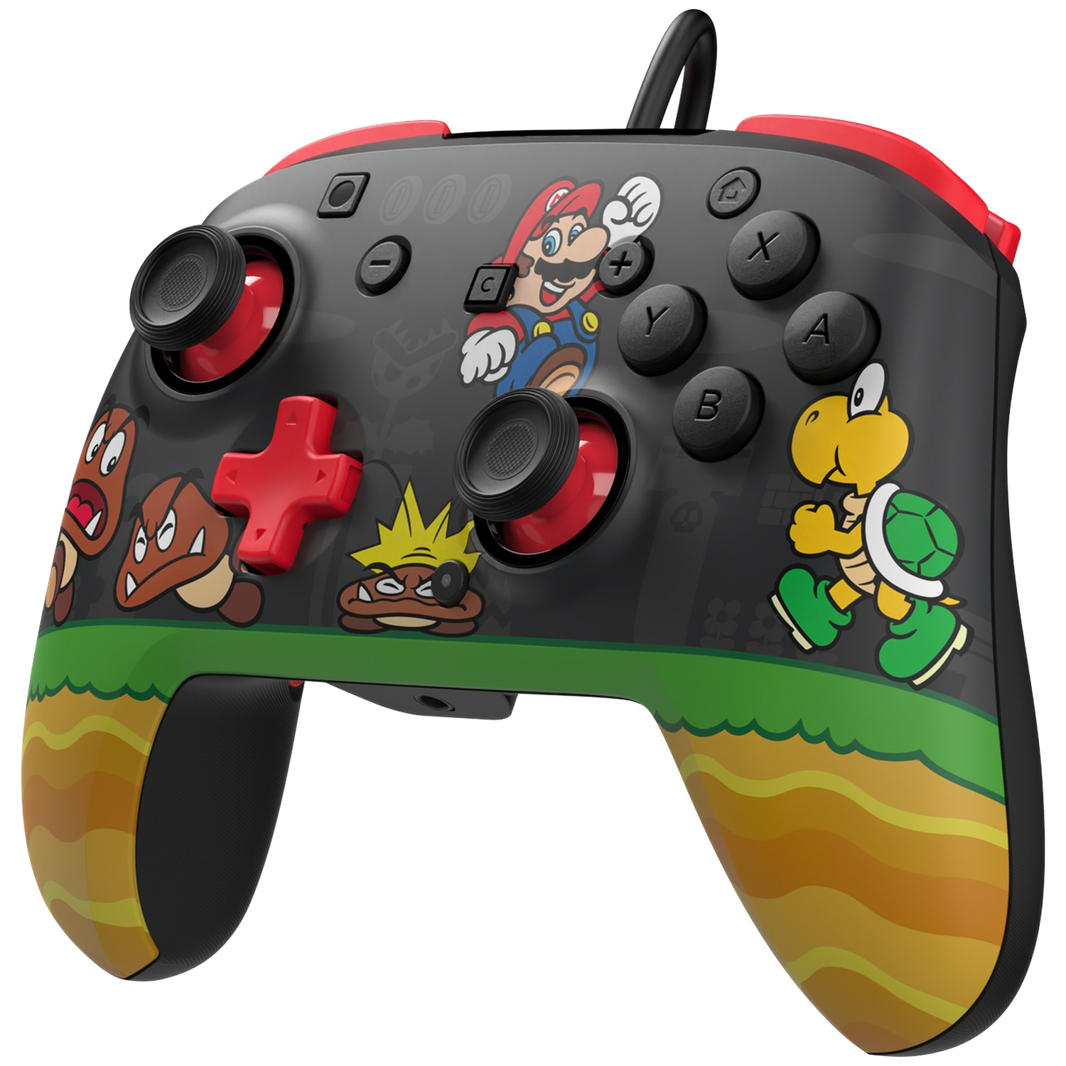 Une manette noire avec des personnages Mario, Goombas et Koopa sur paysage vert.