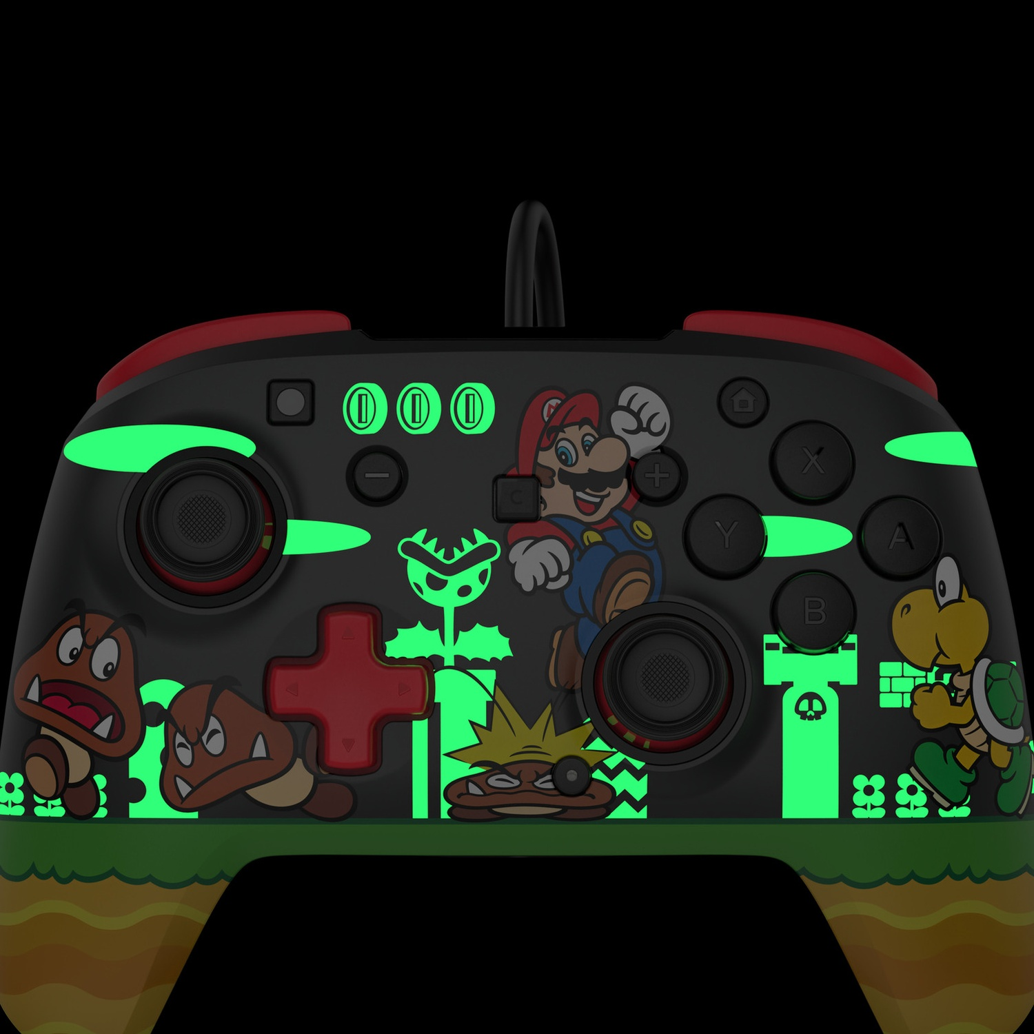 Une manette noire Nintendo avec des personnages de Mario et des accents verts lumineux.