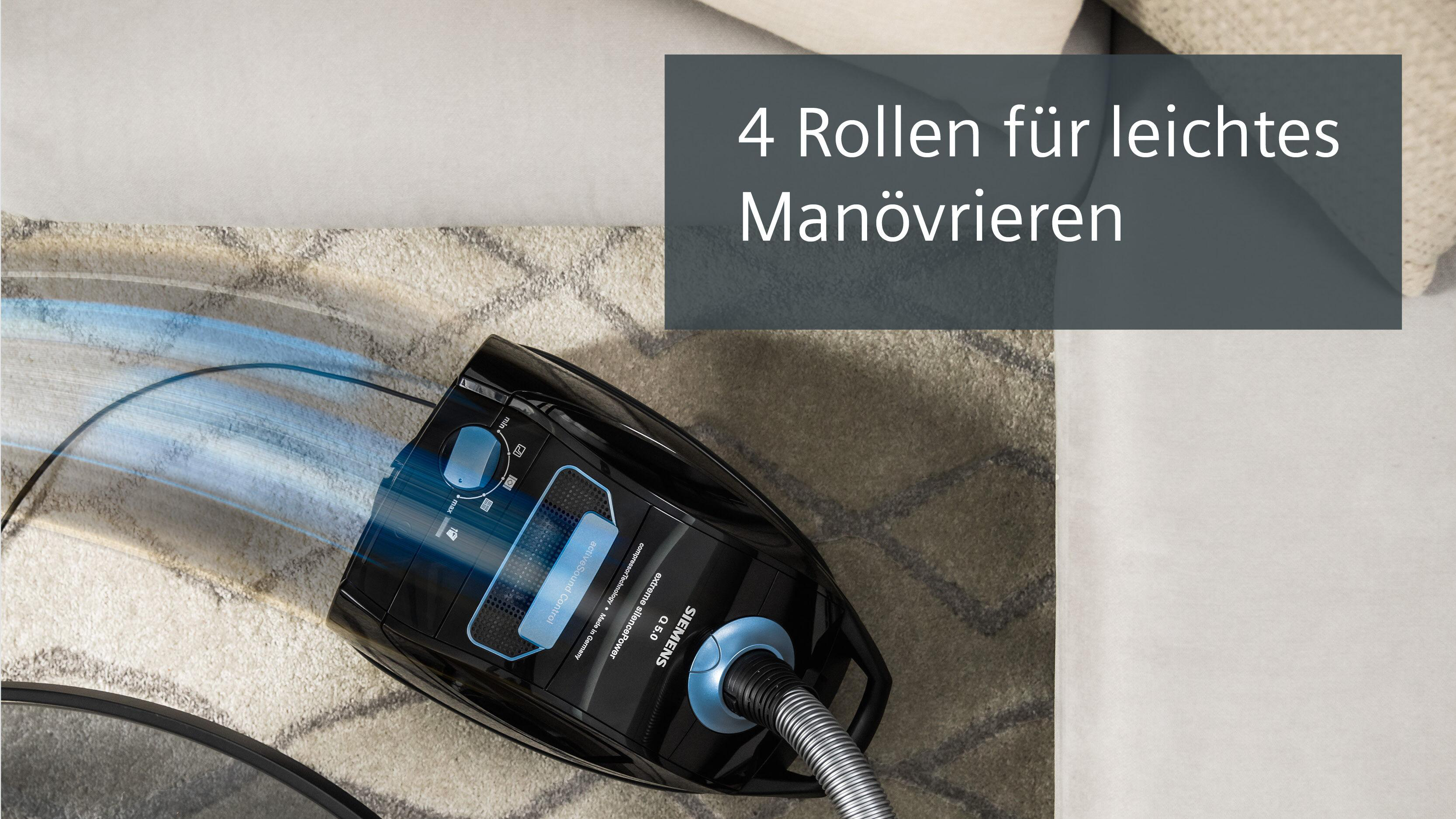 Schwarzer Siemens Staubsauger mit blauen Akzenten auf einem Teppich.