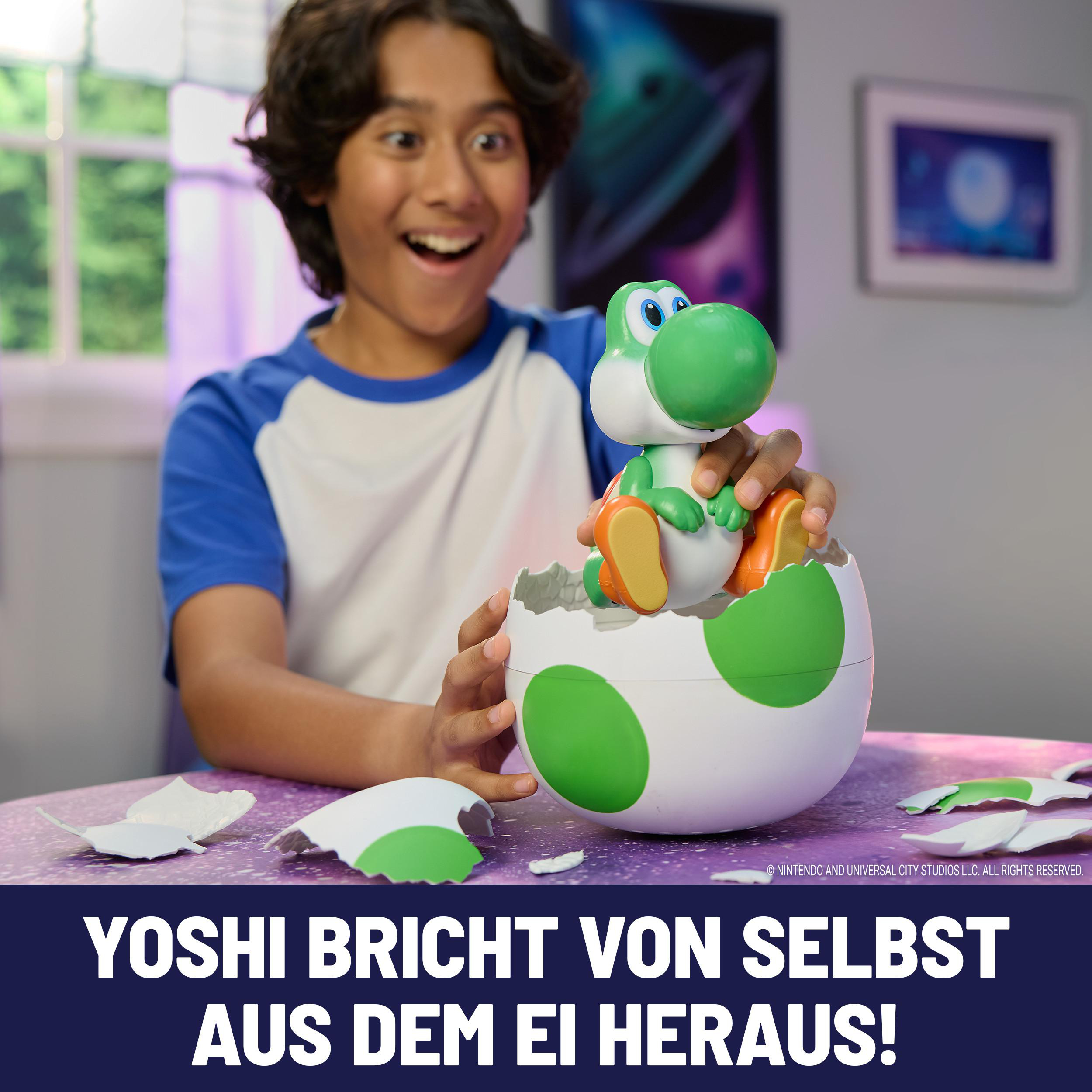 Ein Junge blickt überrascht auf eine Yoshi-Figur, die aus einem zerbrochenen Ei schlüpft.