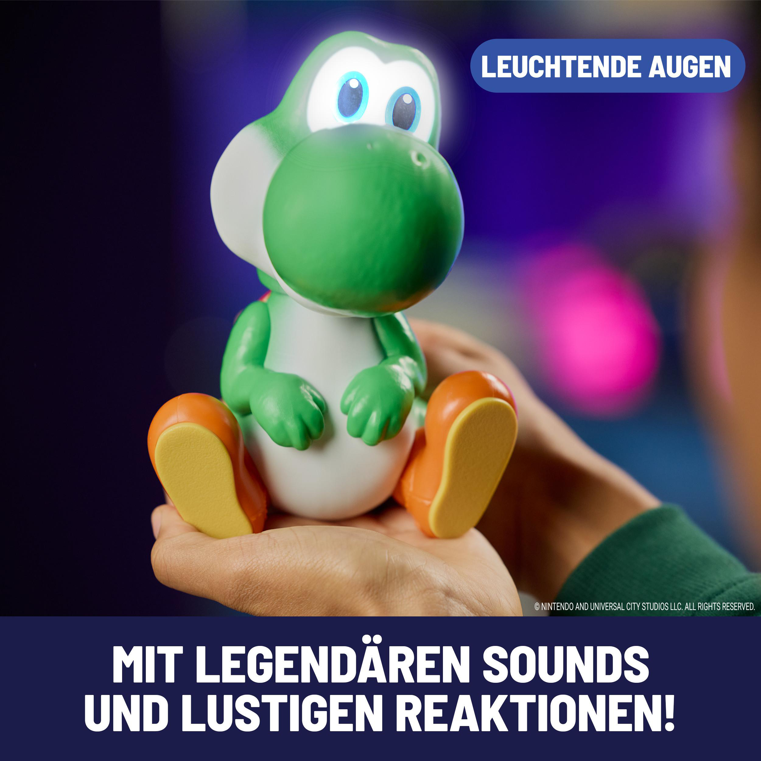 Eine grüne Yoshi-Figur mit leuchtenden Augen sitzt auf Händen. Text: Leuchtende Augen.