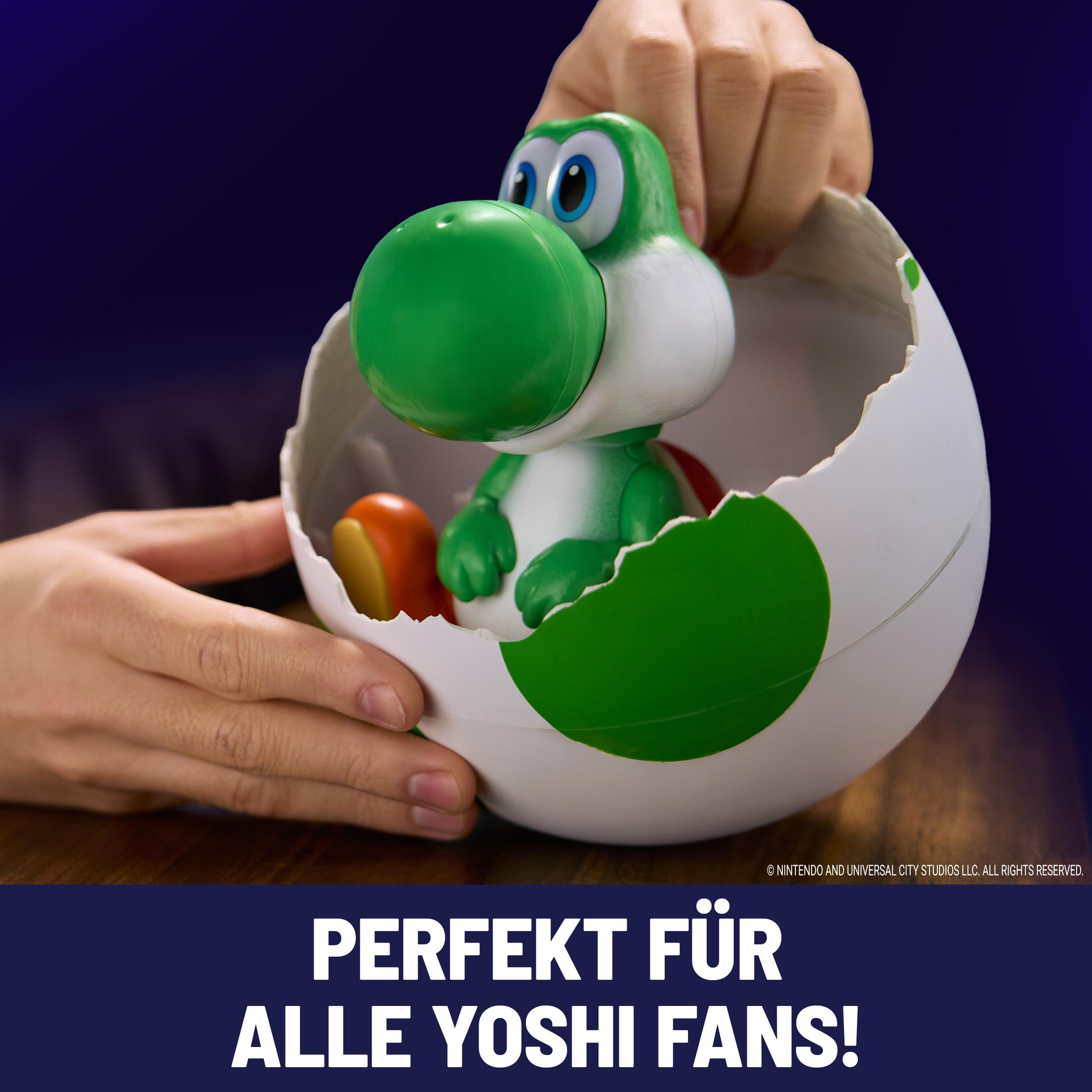 Ein grüner Yoshi sitzt in einem weißen Ei mit grünen Punkten. Hände halten das Ei.