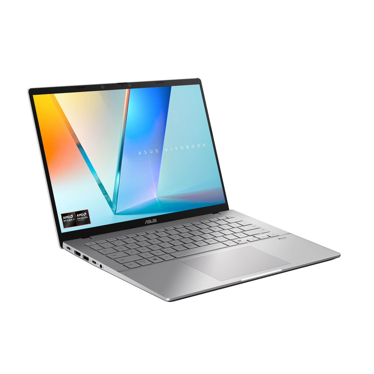 Un portátil Asus Vivobook plateado con pegatinas AMD y un fondo de pantalla colorido.