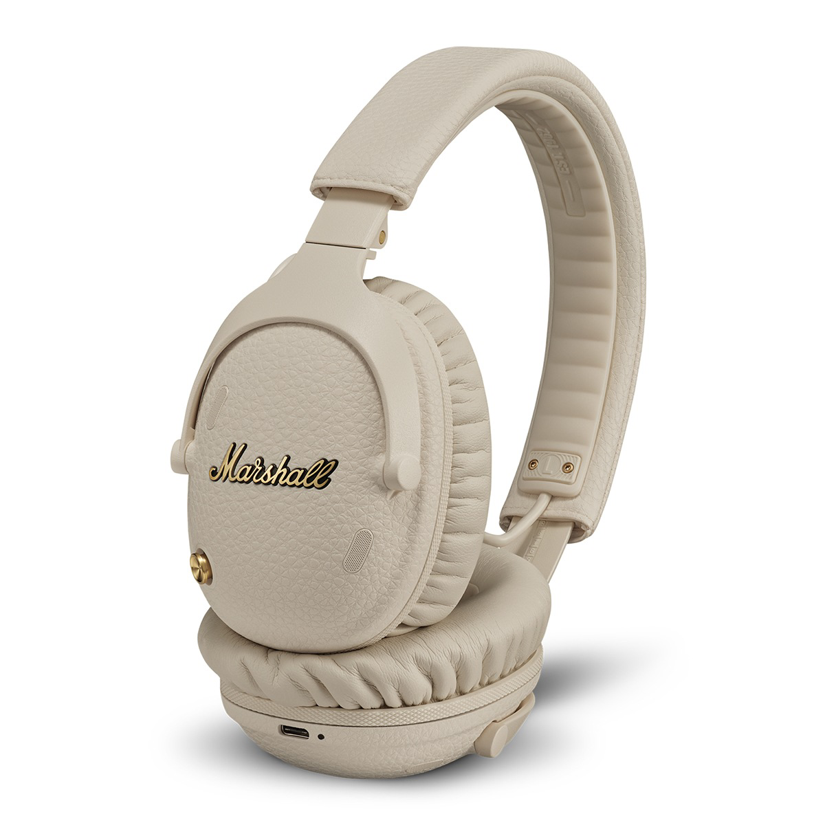 Auriculares Marshall beige con logo dorado y almohadillas.