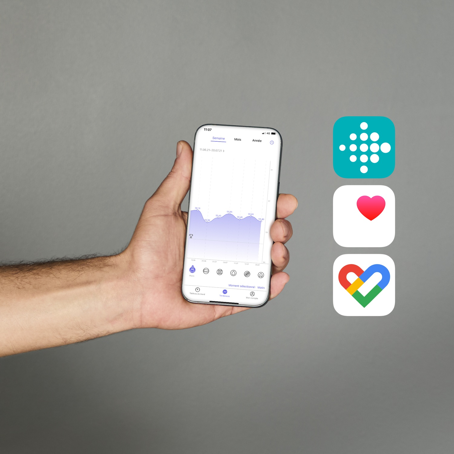 Een hand houdt een smartphone vast met een gezondheidsgrafiek. Drie app-pictogrammen staan ernaast.