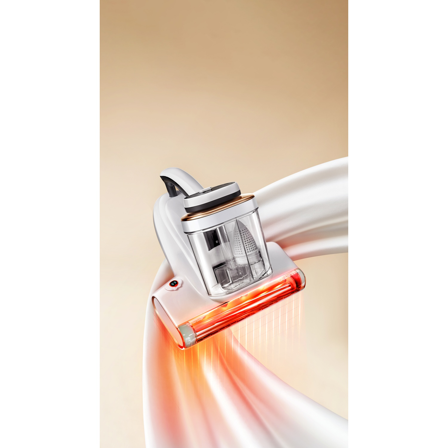 White vacuum cleaner with gold accents, emitting red light. Flowing fabric.