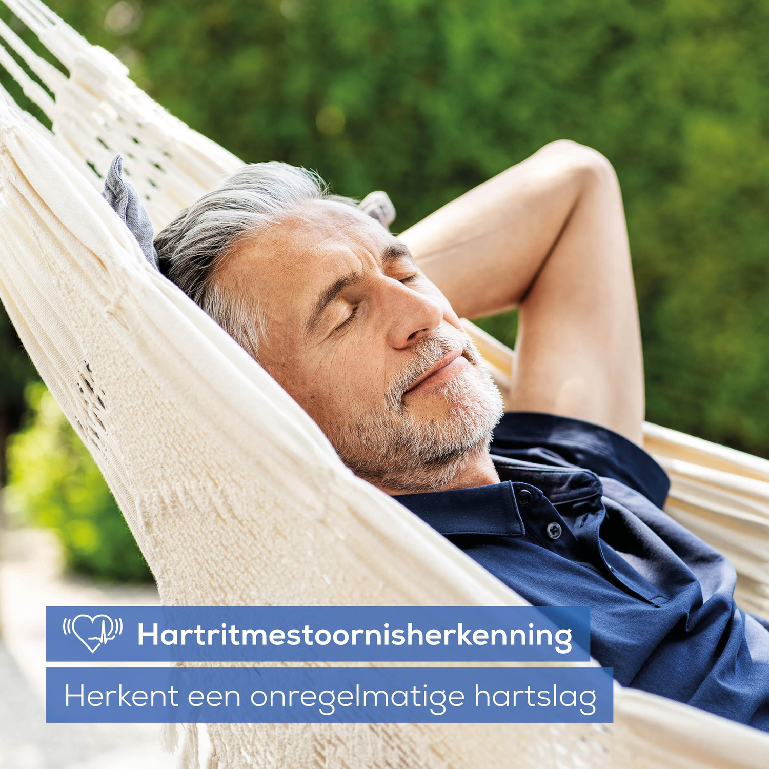 A man with gray hair relaxes in an outdoor hammock.