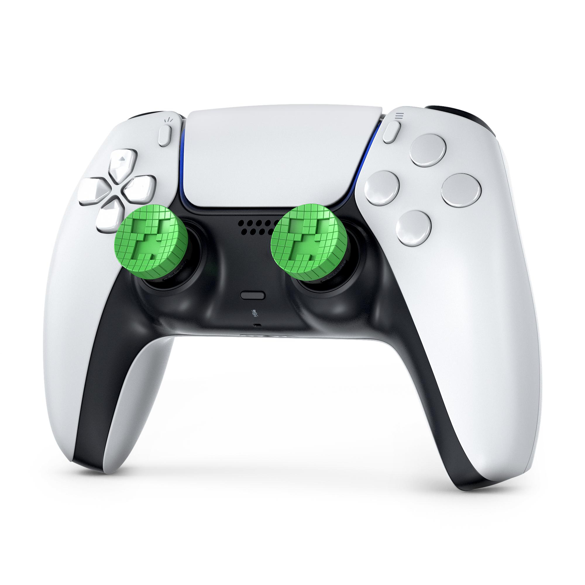 Ein weißer Controller mit grünen Thumbsticks, die ein Creeper-Gesicht zeigen.