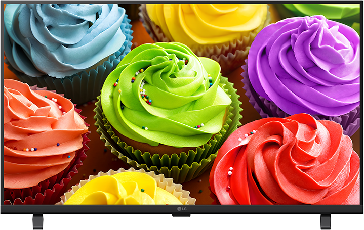 Színes cupcake-ek mázzal és szórócukorral egy asztalon.