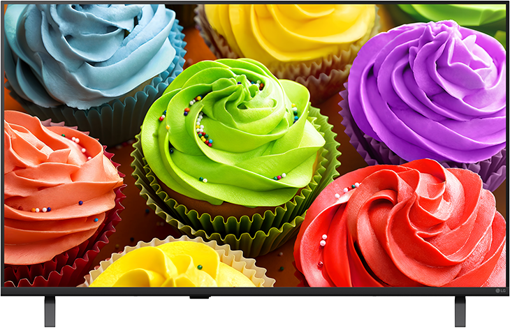 Színes cupcake-ek mázzal és szórócukorral narancssárga háttéren.