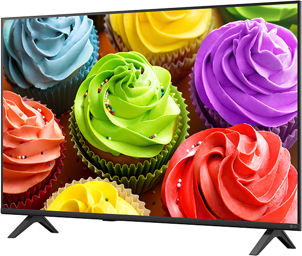 Világos, színes cupcake-ek piros, narancs, zöld, kék, lila és sárga krémmel.