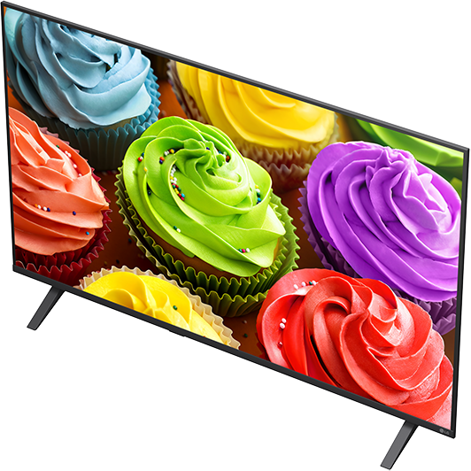 Színes cupcake-ok mázzal és szórócukorral, televízió képernyőjén.